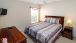 Spacious rental Highlands Reserve Villa in Orlando complete with stunning Bedroom #4 with queen sized bed & wall-mounted LCD cable TV
