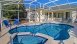 Pool deck with 3 sun loungers, 2 chairs with footstools and additional 2 armchairs - www.iwantavilla.com is the best in Orlando vacation Villa rentals