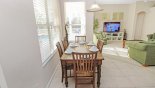 Breakfast nook adjacent to kitchen with seating for 6 and views onto pool deck from Cambridge 4 Villa for rent in Orlando
