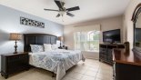 Ground floor master bedroom #1 with king sized bed & views onto pool deck from Solana Resort rental Villa direct from owner
