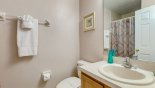 Family bathroom #4 with walk-in shower, single sink & WC with this Orlando Villa for rent direct from owner