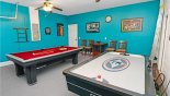 Games room with pool table and air hockey with this Orlando Villa for rent direct from owner