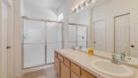 Master #1 ensuite bathroom with large walk-in shower, his & hers sinks & separate WC with this Orlando Villa for rent direct from owner