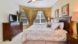 Master bedroom #2 with king-sized bed, LCD cable TV & views onto pool deck from Windsor Hills Resort rental Villa direct from owner