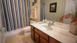 Ensuite bathroom #5 with bath & shower over, single sink & WC with this Orlando Villa for rent direct from owner