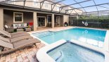 Spacious rental Champions Gate Villa in Orlando complete with stunning South Facing Pool & Spa with four loungers & plenty of covered lanai seating with giant Connect Four game