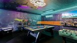 Tron Themed Game Room includes four arcade games, air hockey, foosball, Xbox, and beautiful Tron themed murals. Get ready for Disney's Tron Lightcycle Run ride debuting 4/4/2023! - www.iwantavilla.com is your first choice of Villa rentals in Orlando direct with owner