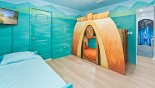 Spacious rental Champions Gate Villa in Orlando complete with stunning Moana themed bedroom #5 features custom village hut & ocean single beds (sleeps 3), beautiful Moana murals, HD TV, access to shared jack & jill bathroom, and Magical Portal connection to Avengers Room.