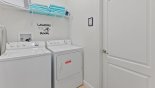 Laundry Room with Washer, Dryer, Drying Rack, Iron, and Ironing Board from Cayman 3 Villa for rent in Orlando
