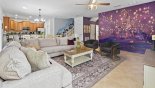 Tangled (Rapunzel) themed Family Room, Dining Room, and Kitchen (downstairs) includes huge HD TV, dining seating for 14, full kitchen, and beautiful mural for pictures with this Orlando Villa for rent direct from owner
