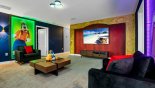 Upstairs entertainment loft with large wall mounted LED smart TV to watch movies together with this Orlando Villa for rent direct from owner