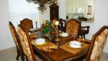 Dining room with dining table & 6 dining chairs (additional 2 available) + 2 chairs at the breakfast bar from Windsor Hills Resort rental Villa direct from owner