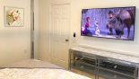 Villa rentals in Orlando, check out the Master bedroom #2 with large wall-mounted Smart 4K TV