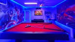 Superhero-themed game room with PS4, pool table, air hockey and basketball game - www.iwantavilla.com is the best in Orlando vacation Villa rentals