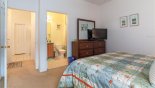 Master 2 bedroom with large LED cable TV - viewed towards ensuite bathroom from Highlands Reserve rental Villa direct from owner