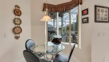 Northampton 1 Villa rental near Disney with Breakfast nook with views onto pool deck - round glass topped table with 4 chairs
