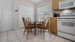 Villa rentals in Orlando, check out the Breakfast nook in kitchen with glass-topped round table & 4 chairs