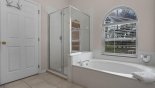 Master ensuite bathroom with bath, walk-in shower & his 'n' hers sinks & WC from Madison 2 Villa for rent in Orlando