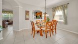 Dining area with glass topped dining table and seating for 6 persons with this Orlando Villa for rent direct from owner