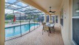 Villa rentals near Disney direct with owner, check out the Covered lanai for the full width of the villa looking out onto extended pool deck