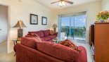 Family room with direct access & views onto balcony - www.iwantavilla.com is the best in Orlando vacation Condo rentals