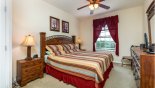 Master bedroom with king sized bed with this Orlando Condo for rent direct from owner