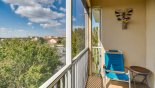 Balcony with additional reclining chair and table - www.iwantavilla.com is your first choice of Condo rentals in Orlando direct with owner