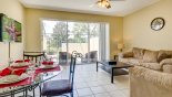 View of family room and dining area towards pool - www.iwantavilla.com is your first choice of Townhouse rentals in Orlando direct with owner