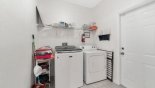 Laundry room with washer, dryer, iron & ironing board - www.iwantavilla.com is your first choice of Villa rentals in Orlando direct with owner