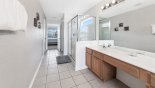 Master #1 ensuite bathroom with large walk-in shower, bath, his & hers sinks & separate WC with this Orlando Villa for rent direct from owner