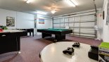 Games room with pool table, air hockey, table foosball, darts & Xbox with this Orlando Villa for rent direct from owner
