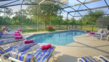 Spacious rental Emerald Island Resort Villa in Orlando complete with stunning South east facing pool overlooking lake & wooded area