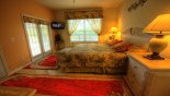 King master bedroom with ensuite bathroom, TV with this Orlando Villa for rent direct from owner