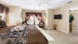 Villa rentals in Orlando, check out the Master 1 bedroom with wall mounted flat screen TV