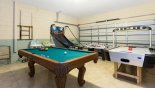 Games room with pool table, air hockey, table foosball and basketball game from Naples Beach 1 Villa for rent in Orlando