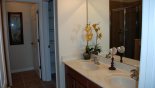 Spacious rental Watersong Resort Villa in Orlando complete with stunning Master 1 ensuite bathroom with bath, walk-in shower, separate WC & double sinks