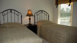 Twin bedroom 3 with views onto pool deck from Beach Palm 1 Villa for rent in Orlando